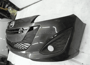 Mazda 5 lift 2010- z kratkami cały zderzak przedni 3