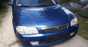 Mazda 323 323f BJ 98-00  Maska lampa zderzak pas atrapa 22V 1