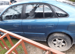 Mazda 626 GF 97-02 błotnik przedni przód Prawy Lewy w lampa szyba  kolor 4