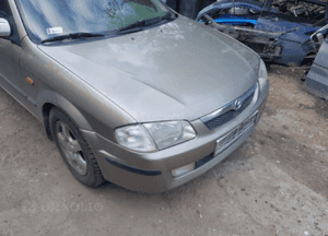 Mazda 323 323f BJ 98-03  Maska lampa zderzak pas atrapa 12M 1