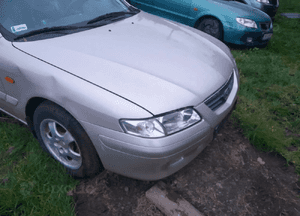 Mazda 626 GF GW 97-02 LIFT    Maska lampa zderzak pas atrapa zamek mocowanie  kolor 4F 2