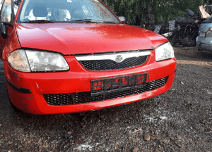 Mazda 323 323f bj 98-03  1.3 1*.5  16V  Zacisk hamulcow przedni przód Jarzmo lewy praw 2