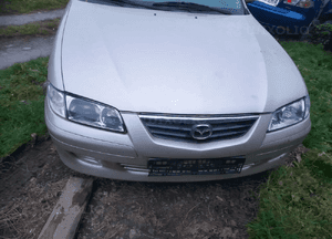 Mazda 626 GF GW 97-02 LIFT    Maska lampa zderzak pas atrapa zamek mocowanie  kolor 4F 1