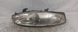 .  PRZOD PRZEDNIA LAMPA LEWA MITSUBISHI COLT 1
