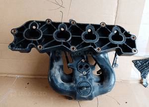 Kolektor ssący Ford Escort MK7 1.6 958-9424-CC 2