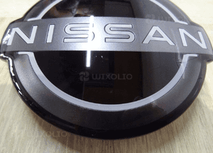 62890-6RA0A 628906RA0A NISSAN Rogue Emblemat Znaczek Grill Zderzak Przód 4