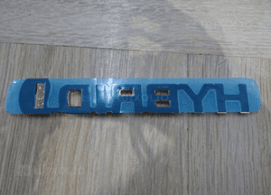 Emblemat napis hybrid toyota auris ii 75374-12040 2