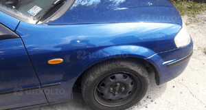 Mazda 323 323f BJ 98-00  Maska lampa zderzak pas atrapa 22V 4