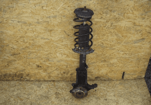 Mcperson amortyzator zwrotnica lewa Peugeot 207