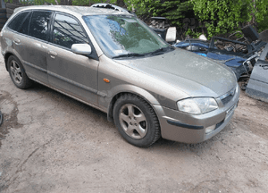 Mazda 323 323f BJ 98-03  Maska lampa zderzak pas atrapa 12M 7