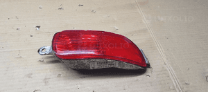 Lampa zderzaka lewy tył tylna lewa Opel Corsa C 24409337 89304951 3