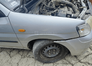 Mazda Demio Błotnik przód przedni  Prawy lift w kolor 18G 22V 7