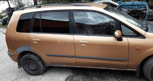 Mazda 323  323f BJ  Premacy Kielich przód przedni mocowanie nadkole 7