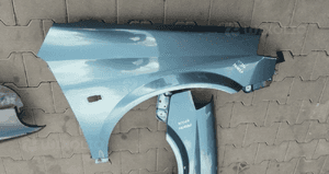 Nissan Primera P12 blotnik przod przedni prawy lew 1