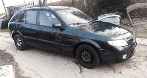 Mazda 323 323f BJ 98-03 Lift  Maska lampa zderzak pas atrapa 18J 6