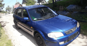 Mazda 323 323f BJ 98-00  Maska lampa zderzak pas atrapa 22V 2