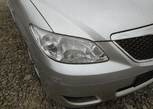 Mazda MPV 04-06 Maska lampa zderzak pas atrapa 22V 4