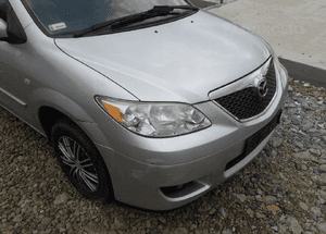 Mazda MPV 04-06 Maska lampa zderzak pas atrapa 22V 2