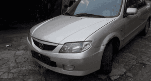 Mazda 323 323f BJ 01-03 Lift  Maska lampa zderzak pas atrapa 22V 10