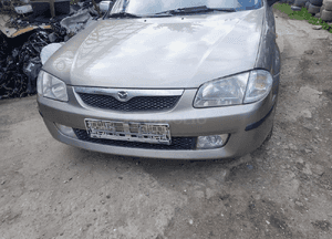 Mazda 323 323f BJ 98-03  Maska lampa zderzak pas atrapa 12M 2