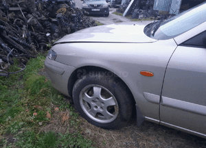 Mazda 626 GF GW 97-02 LIFT    Maska lampa zderzak pas atrapa zamek mocowanie  kolor 4F 10