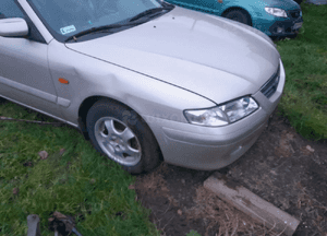 Mazda 626 GF GW 97-02 LIFT    Maska lampa zderzak pas atrapa zamek mocowanie  kolor 4F 6