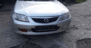 Mazda 323 323f BJ 98-00  Maska lampa zderzak pas atrapa 22V 11