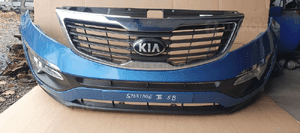 Zderzak przód przedni kompletny grill halogeny KIA Sportage III 3 5B 7