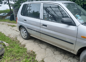 Mazda Demio  Amortyzator Sprężyna przód przedni 4