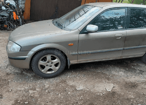Mazda 323 323f BJ 98-03  Maska lampa zderzak pas atrapa 12M 4
