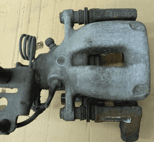 VW Caddy zacisk hamulcowy tył tylny prawy lewy
