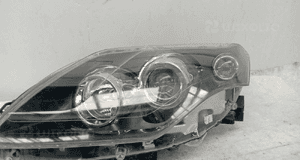RENAULT LAGUNA III lampa przednia lewa SOCZEWKA CIEMNA 260600041R Europa 2