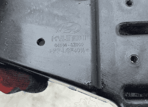 Ślizg wspornik lampy prawy przód 64146-3Z000 hyundai I40 11-19 6