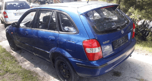 Mazda 323 323f BJ 98-00  Maska lampa zderzak pas atrapa 22V 3