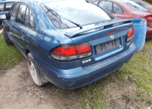 Mazda 626 GF 97-02 HB Klapa tylna tył z szyba drzwi lampa zderzak 1