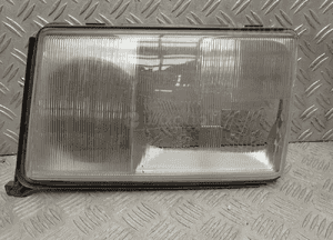 Mercedes W124 ramka lampy lewy przód 1305544027 1