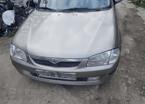 Mazda 323 323f BJ 98-03  Maska lampa zderzak pas atrapa 12M 3