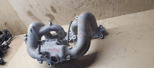 Kolektor ssący Suzuki Liana 1.6 16V E1T26571A 4