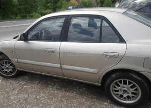 Mazda 626 GF 97-02 Drzwi przedni przód Lewy 4f 4