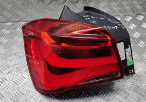 Bmw F20 F21 lampa lewa tył tylna w błotnik 7359017 2